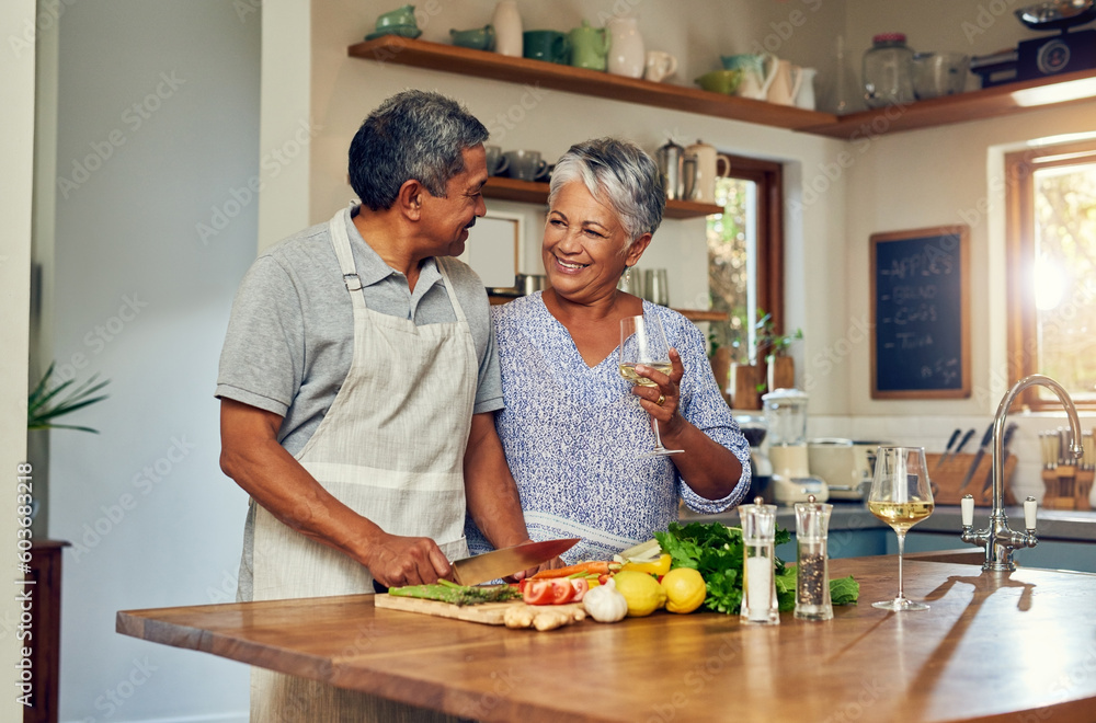 Love, cooking and old couple with wine in kitchen, healthy food and marriage bonding together in home. Drink, glass and senior woman with man, meal prep and vegetables for wellness diet in retirement