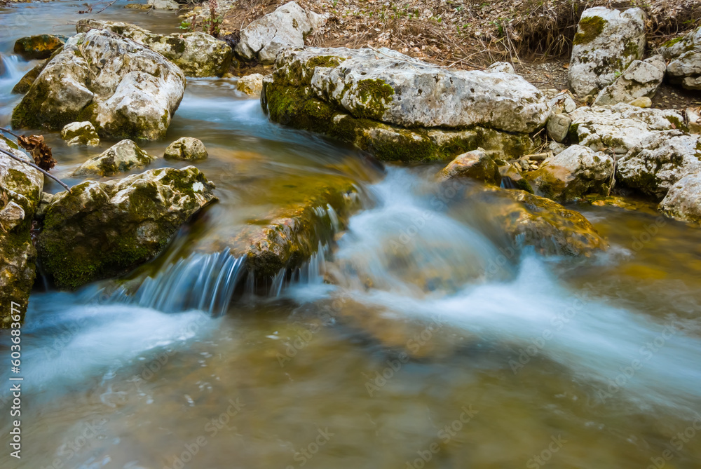 small brook rushing in green mountain canyon, beautiful mountain river scene small brook rushing in green mountain canyon, beautiful mountain river scene