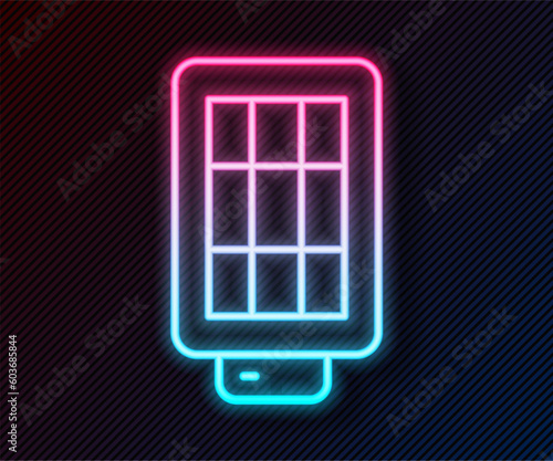 Glowing neon line Studio light bulb in softbox icon isolated on black background. Shadow reflection design. Vector