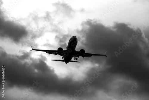 Plane flying with cloudy sky in Alicante, Spain