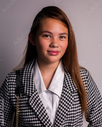 upper class teen girl in a jacket