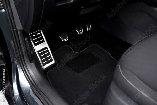 The modern interior of the car is black. Interior details.