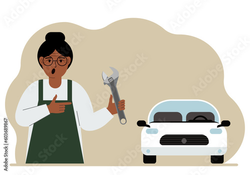 Auto mechanic in a car workshop near a white car. A woman holds a wrench in his hand. Car repair concept. Poster, advertisement, banner.