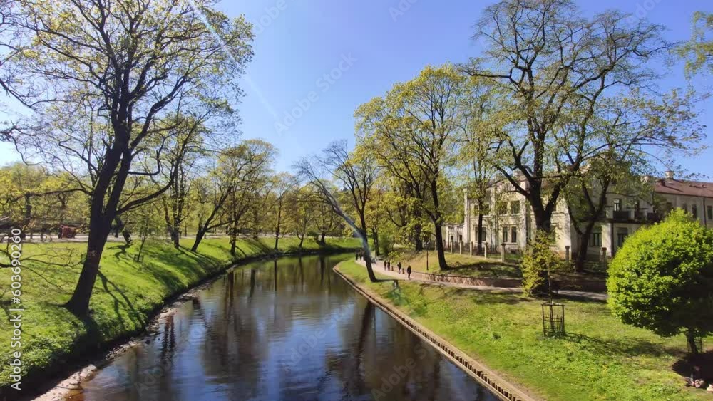 Pond in an urban park. Beautiful spring landscape. Pond in an urban park. Beautiful spring landscape.