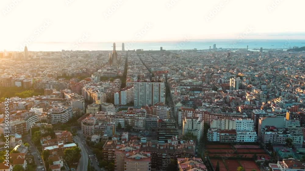 Aerial view of Barcelona Eixample residential district and La Sagrada Familia Basilica at sunrise. Catalonia, Spain Aerial view of Barcelona Eixample residential district and La Sagrada Familia Basilica at sunrise. Catalonia, Spain