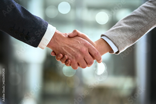 Business man, partner and handshake in meeting, corporate welcome and introduction or lawyer agreement and success. Professional people or clients shaking hands for night b2b, interview or legal deal
