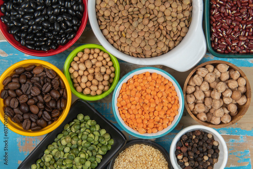 assorted bowls with raw grain and seeds top view