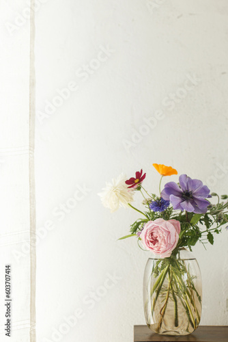 Fototapeta Stylish colorful flowers bouquet on rustic wall background
