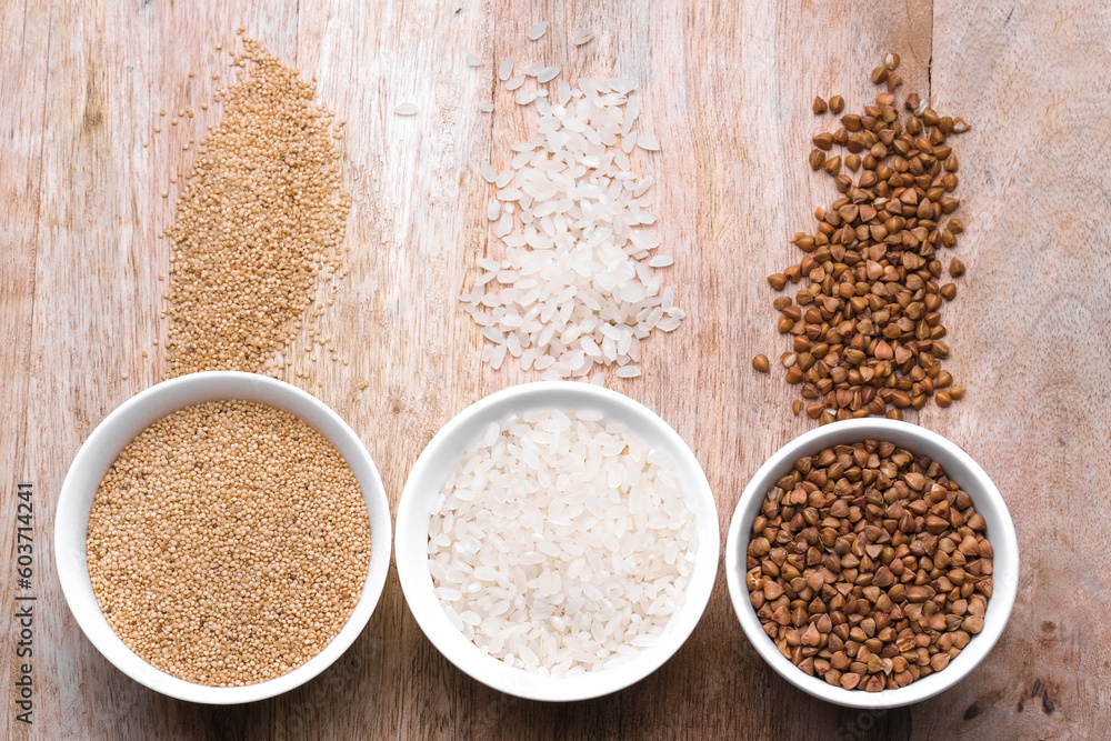 Rice, buckwheat, amaranth seeds. Gluten free seeds in bowls. Top view with copyspace. Rice, buckwheat, amaranth seeds. Gluten free seeds in bowls. Top view with copyspace.