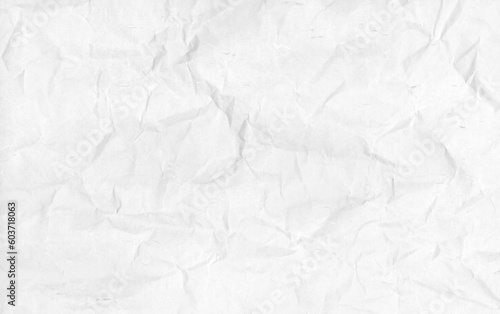 Wrinkled textured white paper background.