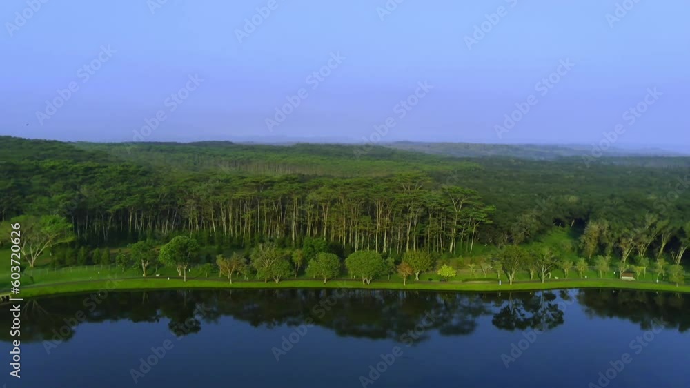 Beautiful landscape in aerial drone shot. Forest trees and calm tranquil lake in Semarang, Indonesia. Beautiful landscape in aerial drone shot. Forest trees and calm tranquil lake in Semarang, Indonesia.