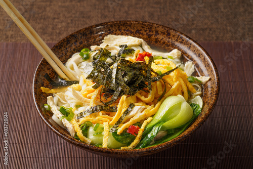 Special Chinese food chicken noodle soup on dark background