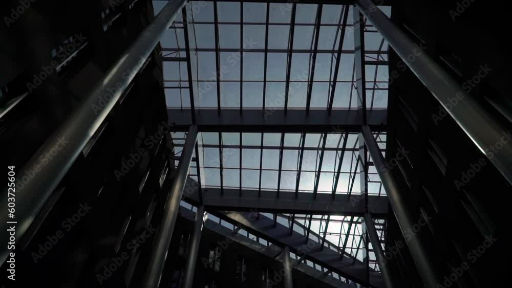 Atrium glass roof of yard inside building - business center, hotel or trade shopping. Atrium glass roof of yard inside building - business center, hotel or trade shopping.