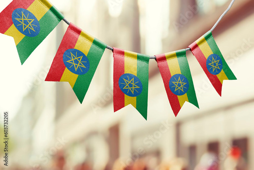 A garland of Ethiopia national flags on an abstract blurred background