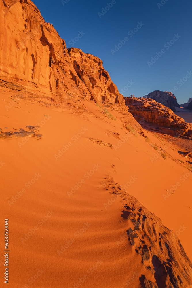 Naklejka premium Amazing and spectacular landscapes of Wadi Rum desert in Jordan. Dunes, rocks are all Beautiful weather gives the climate to this place.