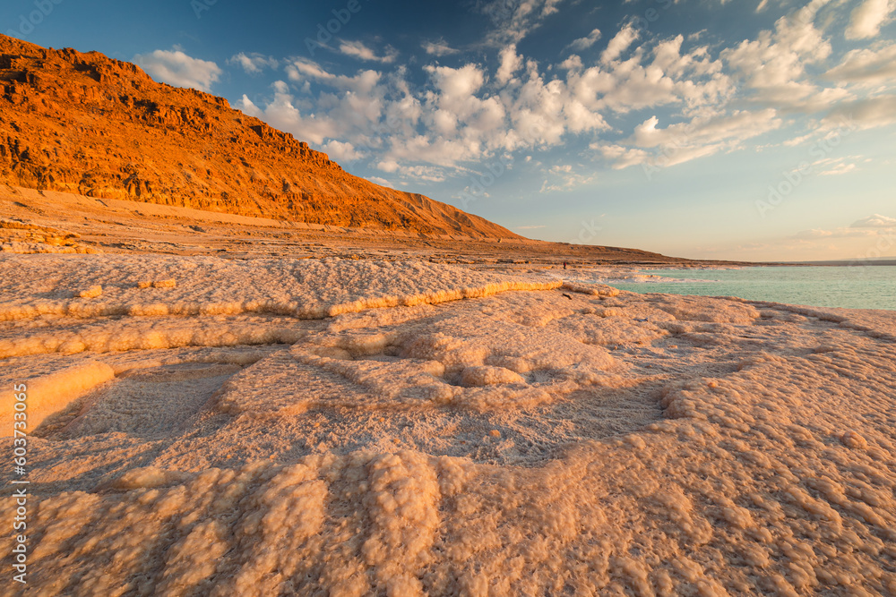 Landscapes from the Dead Sea in the light of the golden hour - interesting salt formations make an amazing impression.