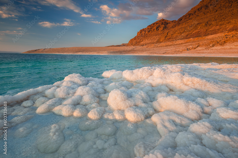 Landscapes from the Dead Sea in the light of the golden hour - interesting salt formations make an amazing impression.