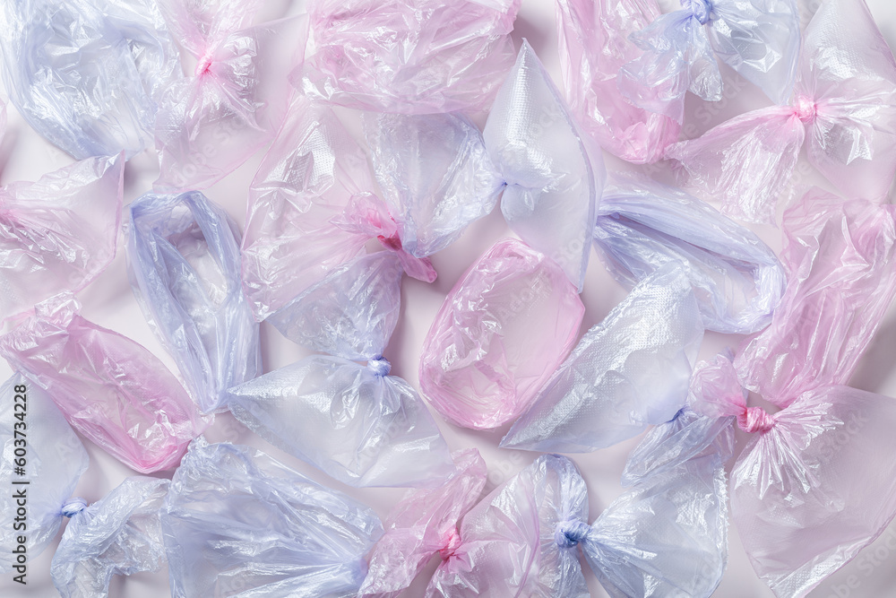 Plastic free environment protection concept. Empty used plastic bags as background. Top view many disposable transparent polyethylene packet, aesthetic texture background. Plastic bag free day Plastic free environment protection concept. Empty used plastic bags as background. Top view many disposable transparent polyethylene packet, aesthetic texture background. Plastic bag free day