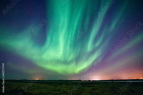 Obraz na plátne A green sky of shimmering and dancing Northern Lights, aurora, in Iceland
