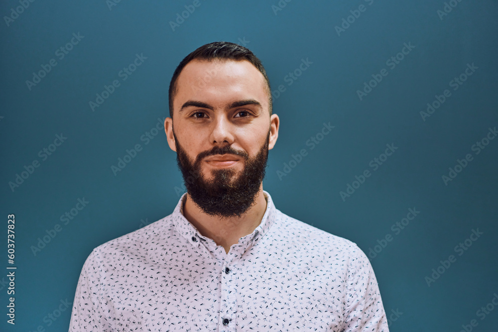 A bearded man portrati isolation on dark blue background A bearded man portrati isolation on dark blue background