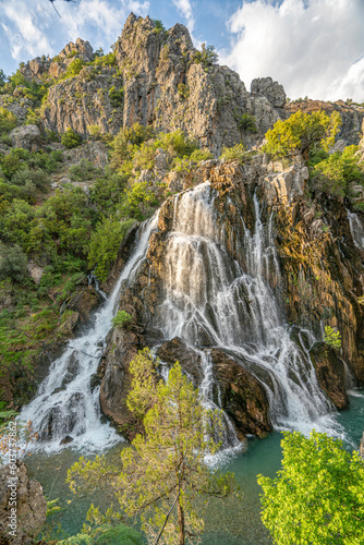 impressive view of Cündüre waterfall, which is one of the biggest one around in Antalya and it springs out from many cracks and rifts on the face of the mountainous terrain, falling about 40 meters.