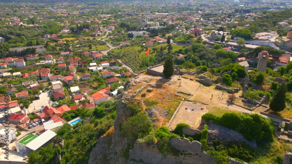The drone captures a mesmerizing view of the ruins of Stari Bar, showcasing the remains of stone buildings that hold historic significance. This stock video depicts the beauty of Montenegro's ancient The drone captures a mesmerizing view of the ruins of Stari Bar, showcasing the remains of stone buildings that hold historic significance. This stock video depicts the beauty of Montenegro's ancient