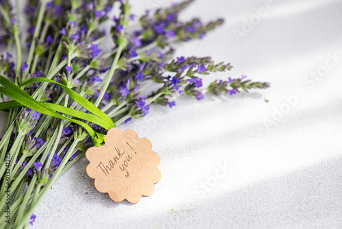 Front view of summer interior decor with fresh lavender flowers on the concrete background photo