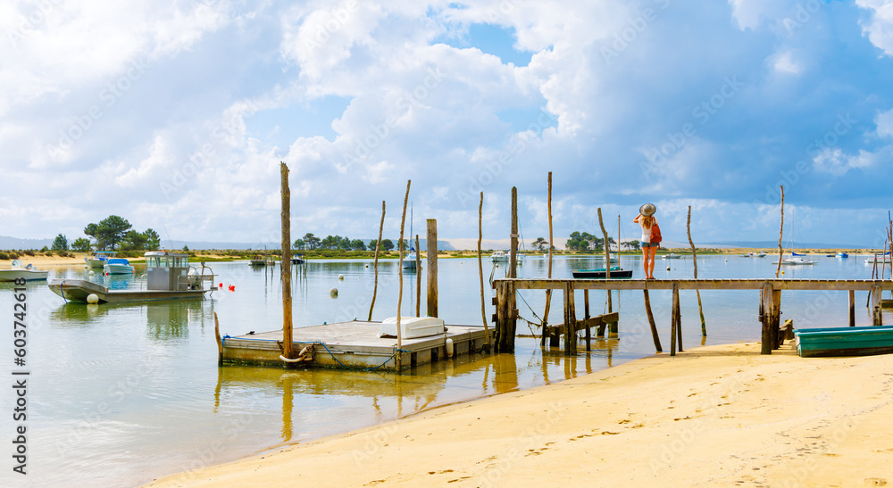 Arcachon basin in France- fishing boat and wooden pier, atlantic ocean, harbor- tourism in Landes - obrazy, fototapety, plakaty 