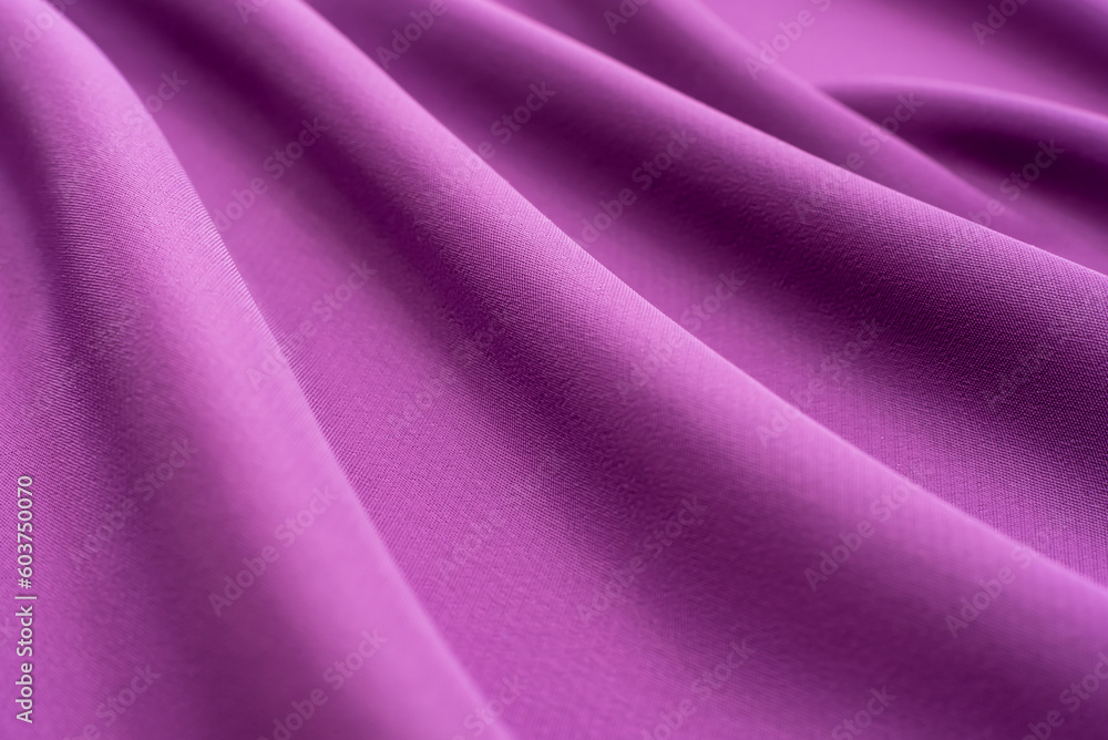 Texture of a smooth luxurious, elegant fabric in burgundy, purple, red. Purple satin or silk fabric with folds and waves Texture of a smooth luxurious, elegant fabric in burgundy, purple, red. Purple satin or silk fabric with folds and waves