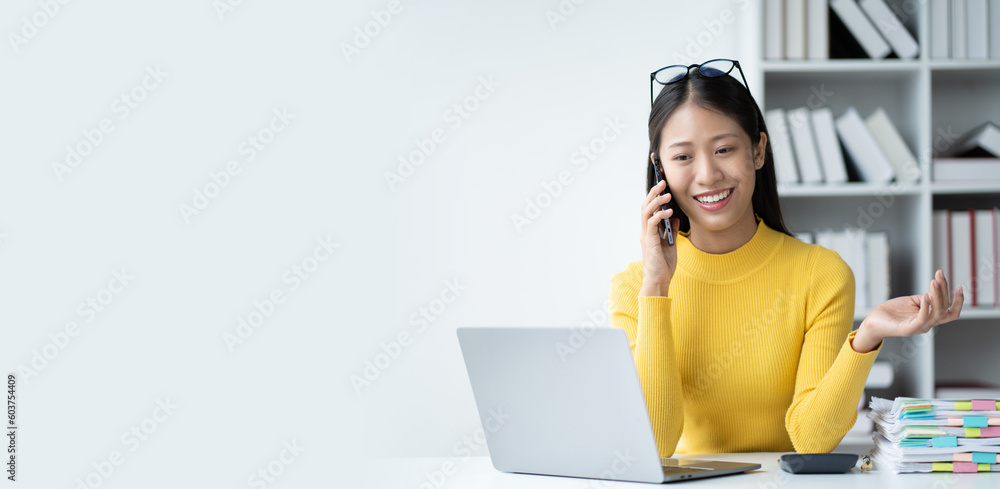 Young Adorable businesswoman having a phone call with her coworker in the office room. Young Adorable businesswoman having a phone call with her coworker in the office room.