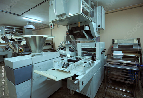 Fototapeta Naklejka Na Ścianę i Meble -  An automatic production dough line prepared for work, bakery. Ukraine