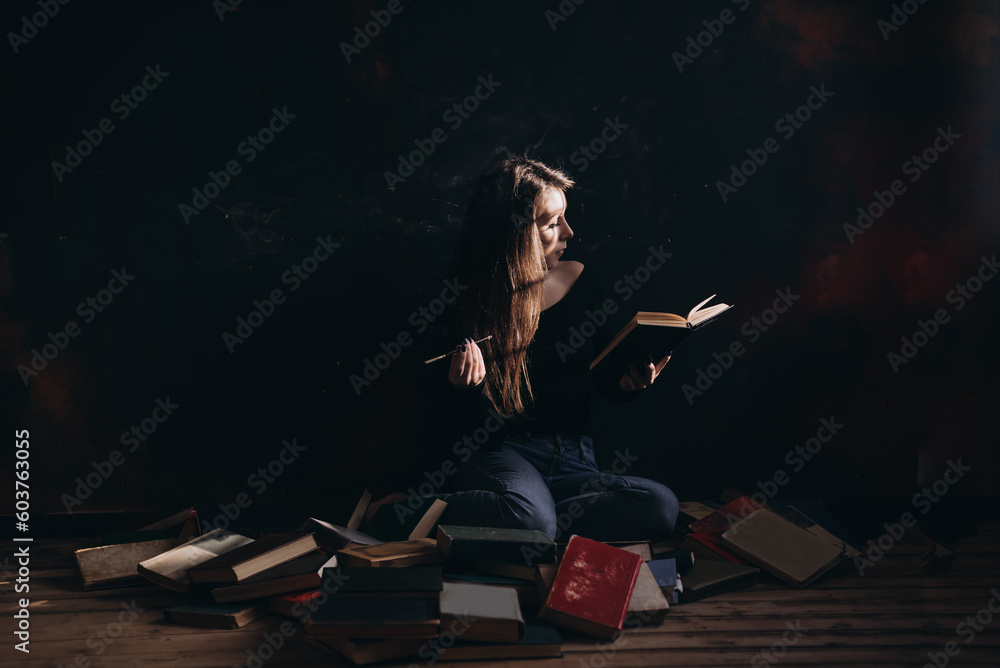 A relaxed woman sitting, smoke and reads in a room full of books A relaxed woman sitting, smoke and reads in a room full of books