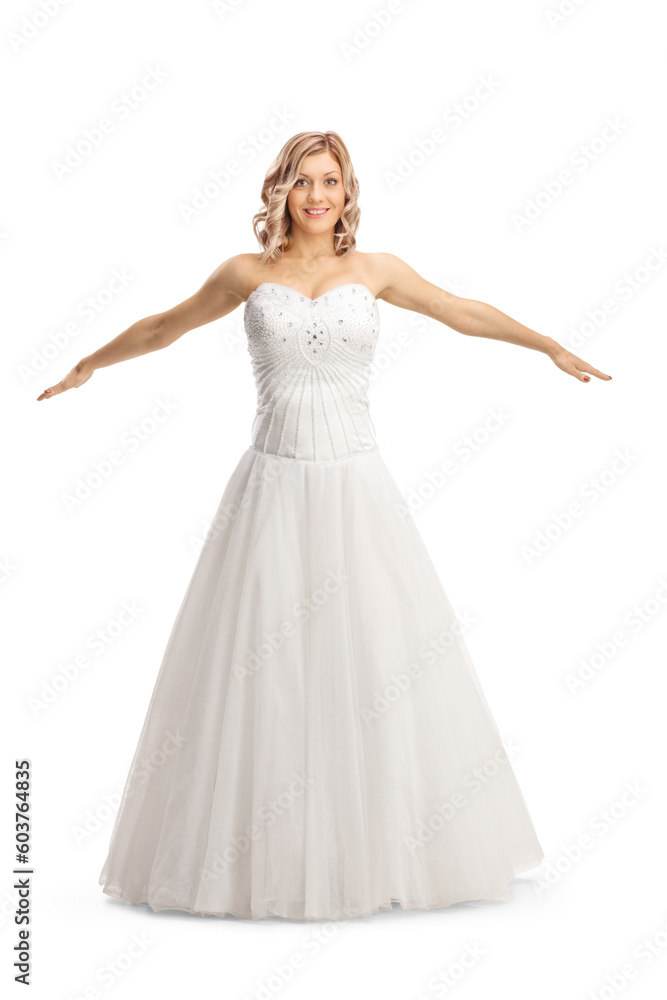 Beautiful bride in a gown spreading arms Beautiful bride in a gown spreading arms