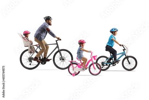 Father with three children riding bicycles