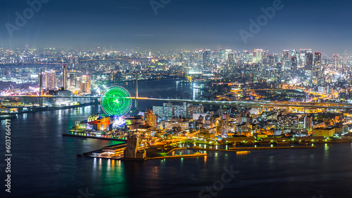 Aerial view of city with bright light on port of Kobe at night.