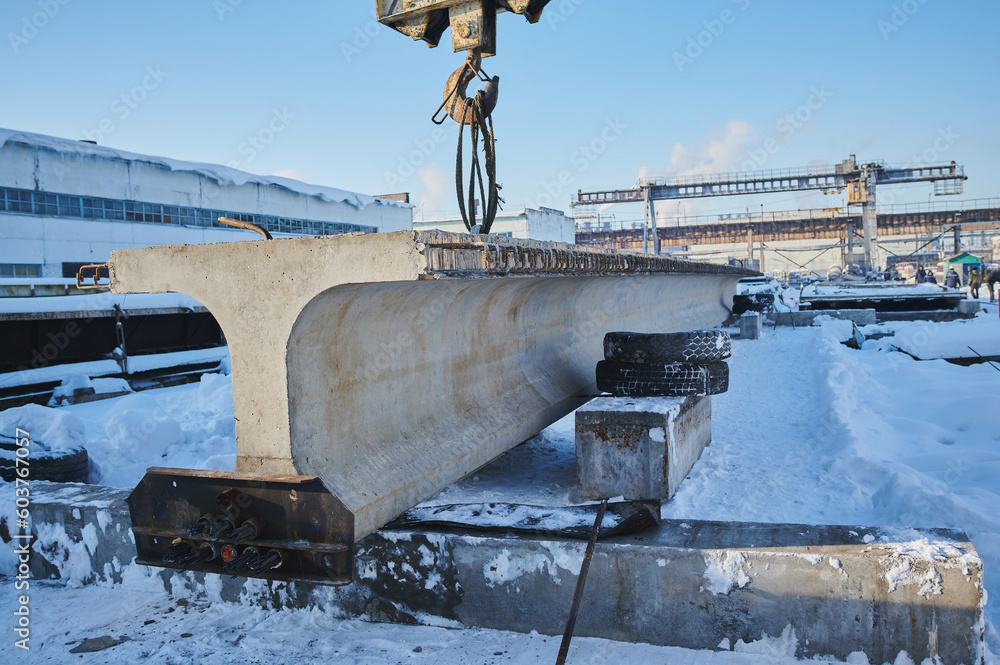 Row of reinforced concrete foundations with metal anchor bolts designed ...