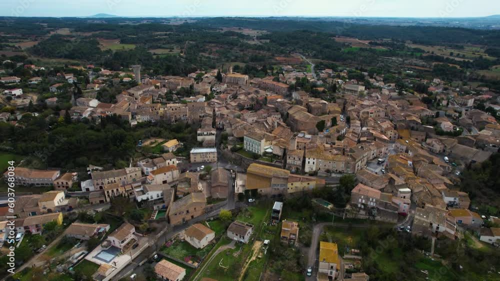 Aerial around the city Castelnau-de-Guers on a sunny day in early spring. Aerial around the city Castelnau-de-Guers on a sunny day in early spring.