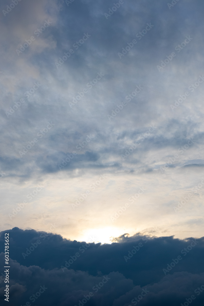 Dark blue clouds at the bottom of a bright sky Dark blue clouds at the bottom of a bright sky
