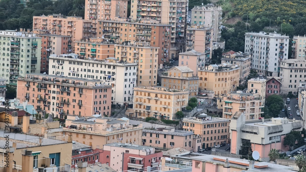 Genoa, Italy - May 6, 2023: Top view of the city of Genoa at sunset from the mountains. Aerial view of Genoa and Sampdoria soccer teams stadium in Genoa Marassi in Italy.