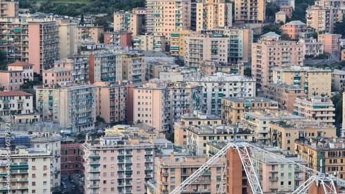 Genoa, Italy - May 6, 2023: Top view of the city of Genoa at sunset from the mountains. Aerial view of Genoa and Sampdoria soccer teams stadium in Genoa Marassi in Italy. photo
