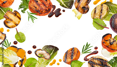 Warm salad, grilled meet slices and chopped barbecue vegetables with herbs and salad leaves isolated on white background, frame of bbq beef, chicken, carrot, zucchini and onion