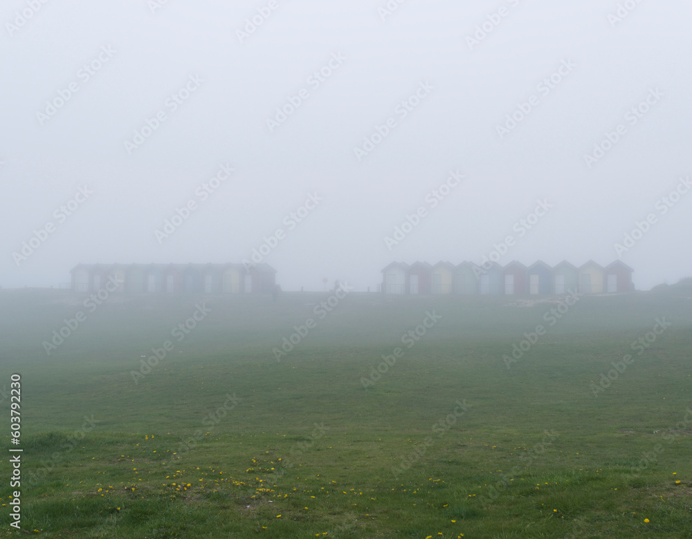 Blyth beach huts in mist