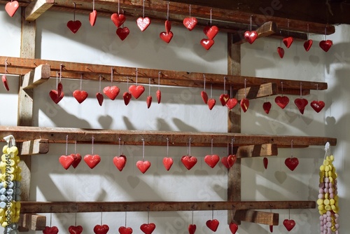 Litlle red hearts hanging on the wall, decoration, gingerbread hearts
