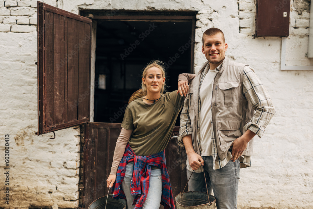 Two people working on a farm. Two people working on a farm.