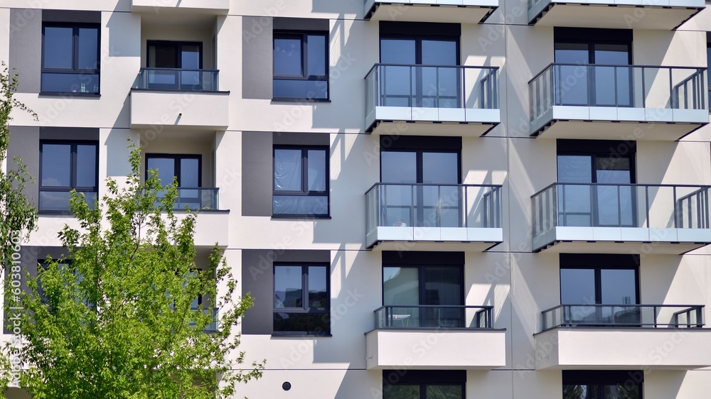 Eco architecture. Green tree and new apartment building. The harmony of nature and modernity. Modern residential building with new apartments in a green residential area. Eco architecture. Green tree and new apartment building. The harmony of nature and modernity. Modern residential building with new apartments in a green residential area.