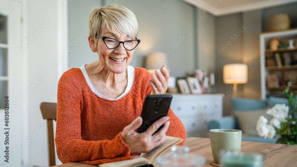 One senior blonde woman use digital tablet for video call at home One senior blonde woman use digital tablet for video call at home