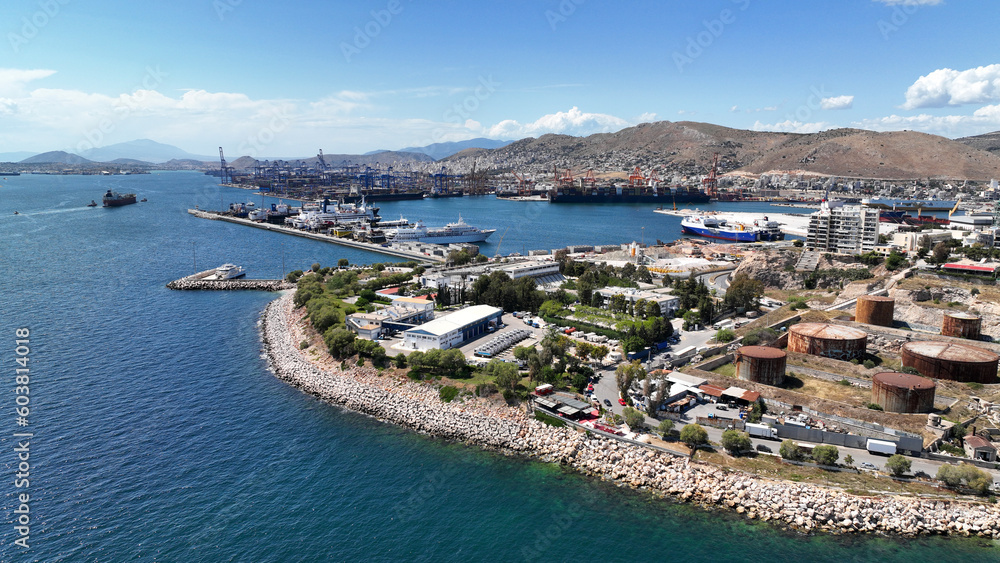 Aerial drone view from abandoned public fertiliser factory as seen at sunny winter slightly cloudy morning, Piraeus main port, Attica, Greece