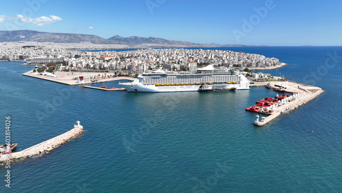 Aerial drone photo of crowded cruise liner ship with pool facilities anchored in Port of Piraeus, Attica, Greece