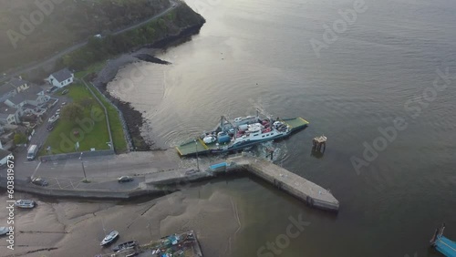 Drone River Suir, Ireland - Aerial view of The Passage East Ferry across River Suir linking the villages of Passage East in Co. Waterford and Ballyhack in Co. Wexford photo