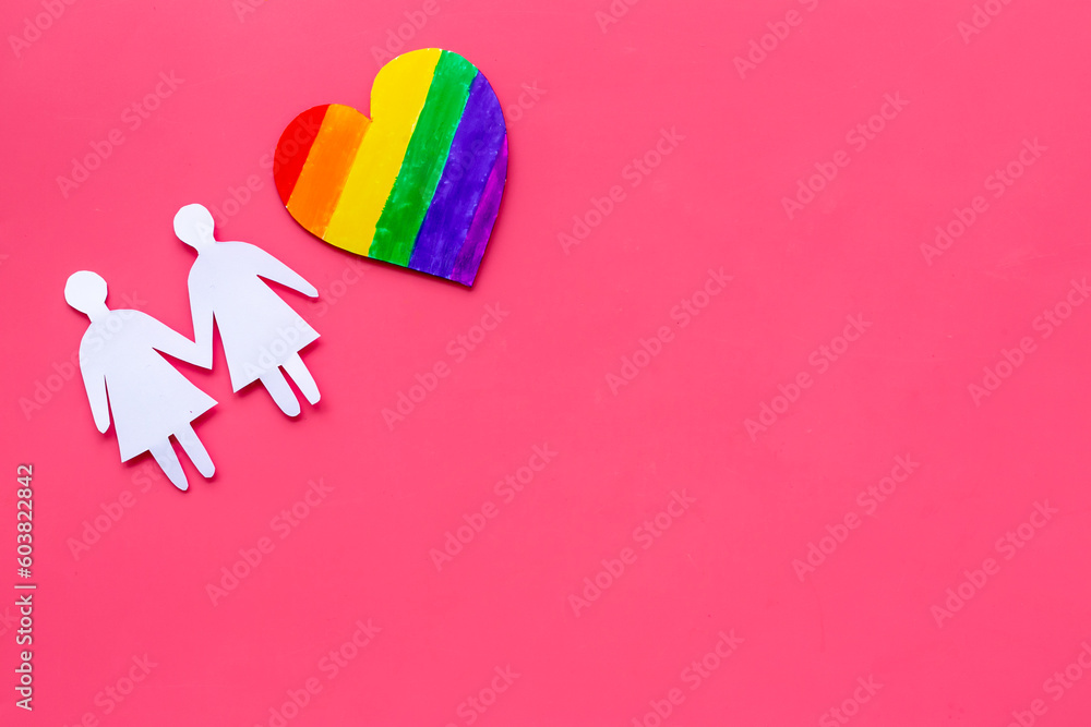 Gay pride rainbow LGBT paper heart with women paper shapes. LGBT social rights concept.
